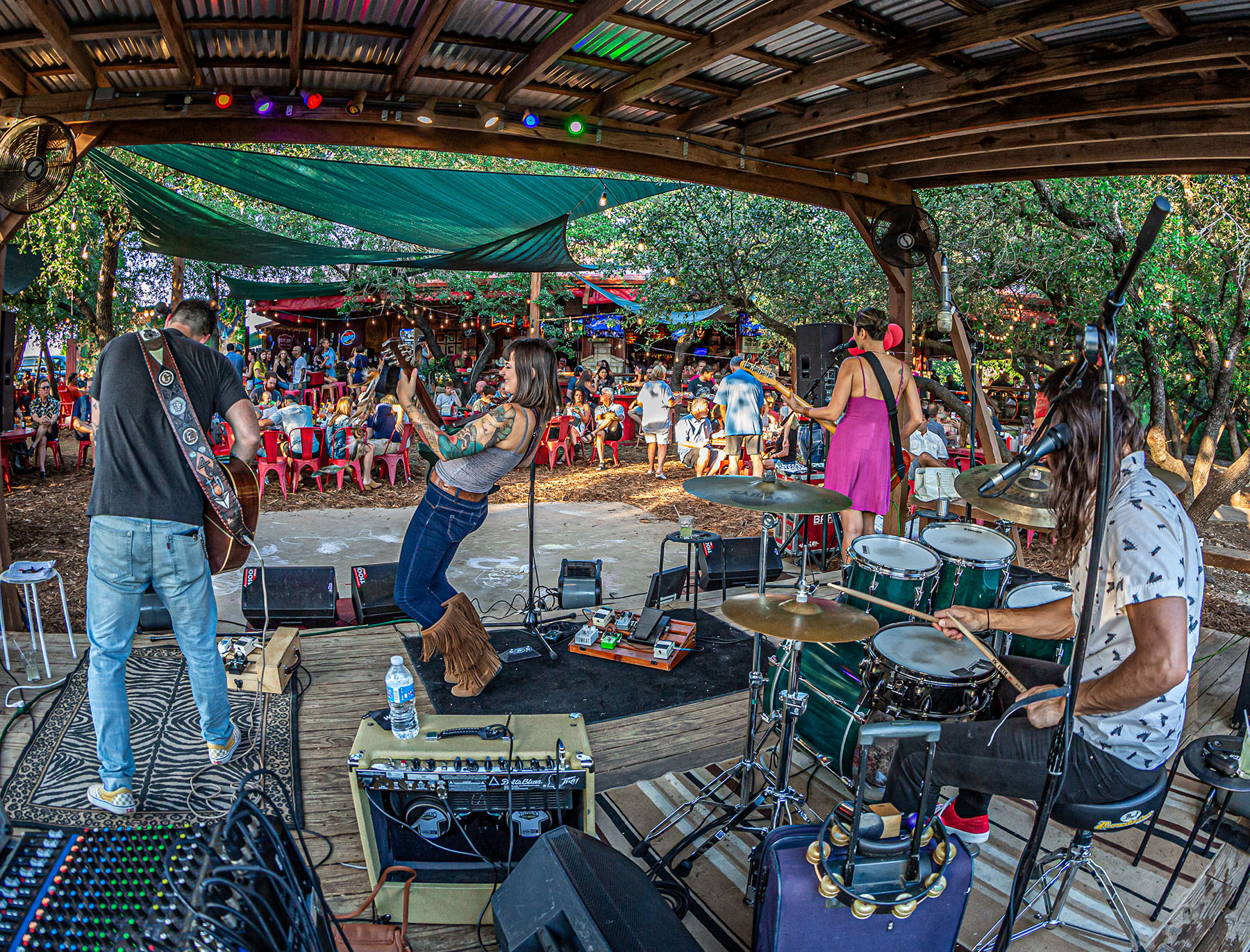 Live music under the palapa at Angel's Icehouse in Spicewood. Photo: Will Taylor - LakeTravis.com