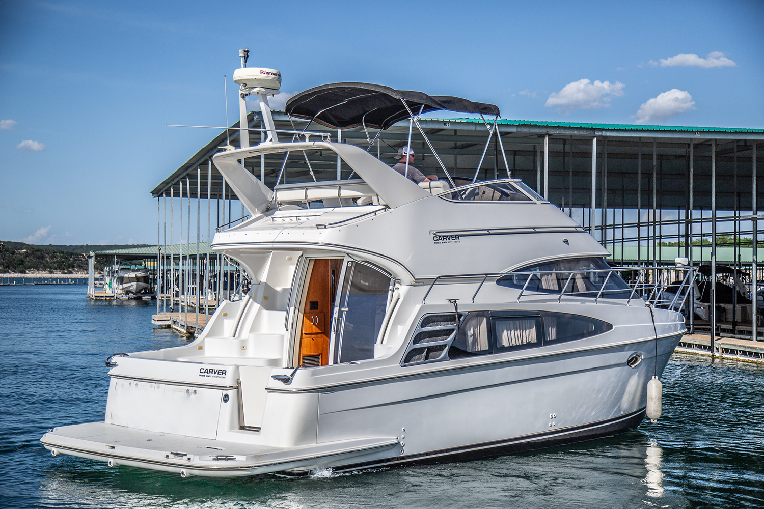 Lake Travis Yacht Rental's Carver 360 Sport Sedan  “Moonraker”  pulling out of the slip.